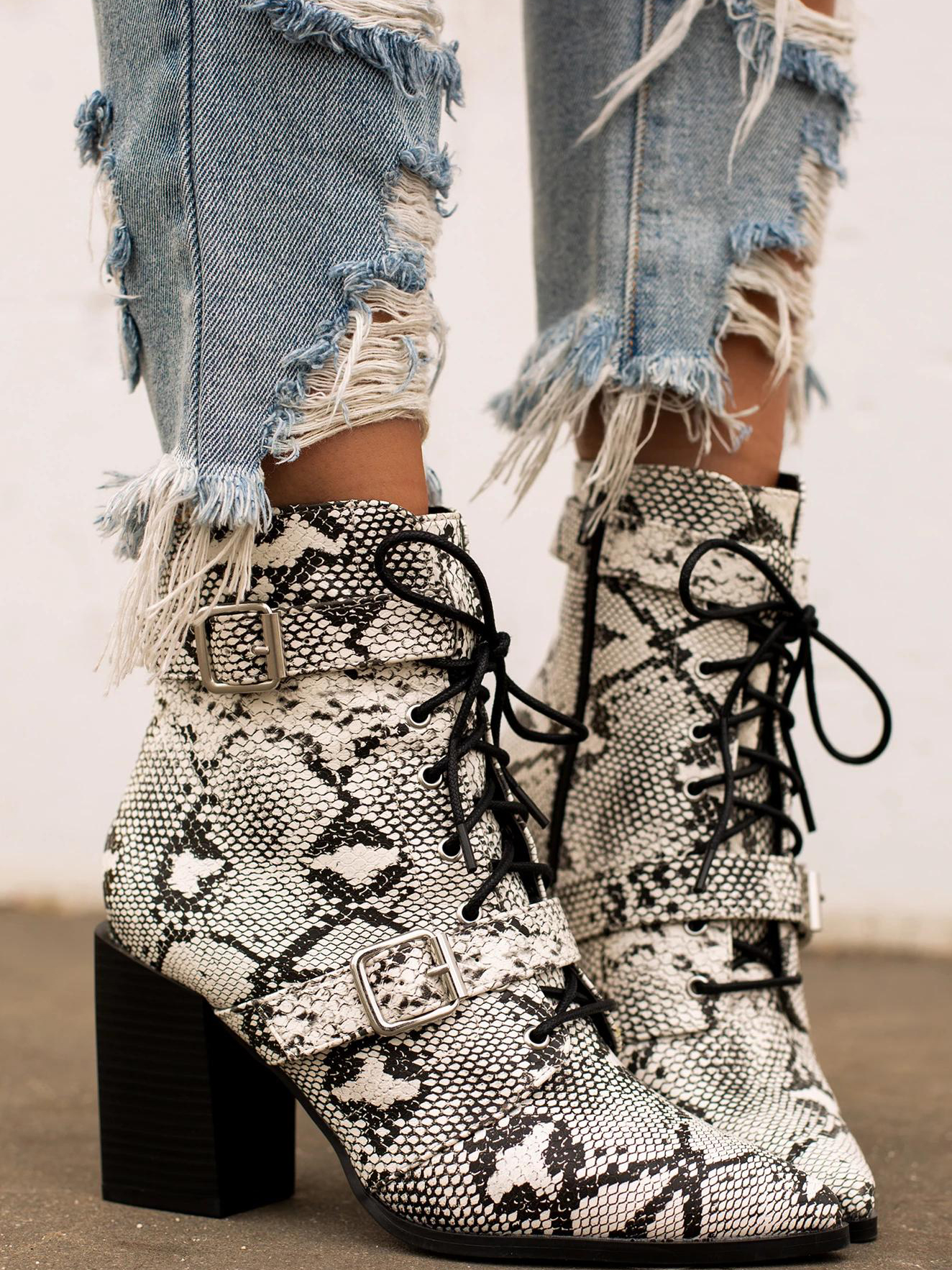 snakeskin booties with buckles